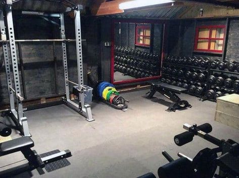 Rustic Man Cave Home Gym With Bench Press And Free Weights Rack Bench Press Rack, Basement Home Gym, Basement Gym Ideas, Gym Bench, Home Gym Basement, Home Gym Ideas, Gym Lighting, Home Gym Flooring, Home Gym Garage