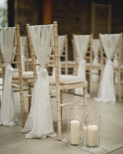 Simple and elegant aisle detailing ✨ @lewis_fackrell_photography @sttewdricshouse @lumieventflowers . . . #wedding #weddingdesign #weddingstylist #eventdesign #weddingdetails #weddingseason #weddingdecor #weddinginspo #weddingvibes #eventinspo #events #southwalesevents #neutralwedding #neutrals #weddingflorals #weddingflowers #weddingday #sttewdrics #aisle #aisledetails #weddingceremony Wedding Chair Draping, Aisle Decorations Wedding Simple, Modern Wedding Aisle Decor, Wedding Aisle Flowers On Chairs, Aisle Chair Decorations Wedding, Simple Wedding Aisle Decor, Wedding Ceremony Chair Decor, Neutral Wedding Ceremony, Wedding Aisle Chair Decor