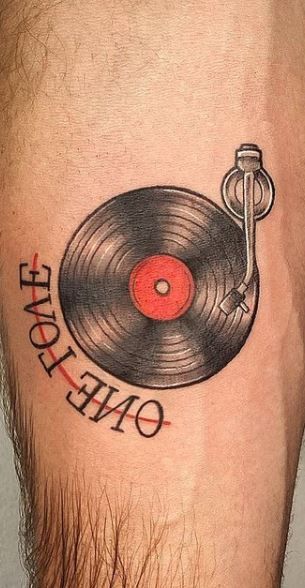 Punk Music Tattoo, 1980s Tattoos, Vinyl Record Tattoo Traditional, Men Music Tattoo Ideas, Traditional Record Tattoo, Vinyl Record Tattoos, Vynil Record Tattoo, Record Tattoo Ideas, Guitarist Tattoo