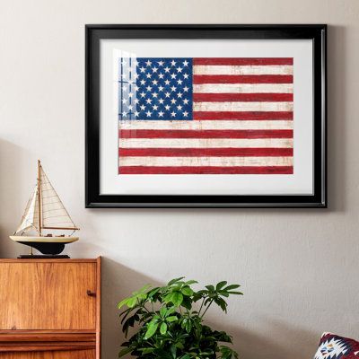 Old Glory Premium Framed Print - Ready to Hang Framed in distressed wood and available in an array of sizes and colorsFeaturing a beveled a solid wood stretcher bar, each piece comes ready to hand4 SIZES AVAILABLE30.5''X42.5'' - Overall Size26.5'X36.5'' - Overall Size22.5''x30.5'' - Overall Size18.5''x24.5'' - Overall SizeEach piece is made to order. Each piece comes with hanging hardware. Made in the USAReady to HangGiclee Paper PrintAcrylic GlassBeveled Matt BoardFeatures:Premium Framed Print Framed Flags Ideas, Framed American Flag, American Flag Decor, Shadow Frame, Framed Flag, Gold Frames, Big Boy Room, Old Glory, Distressed Wood