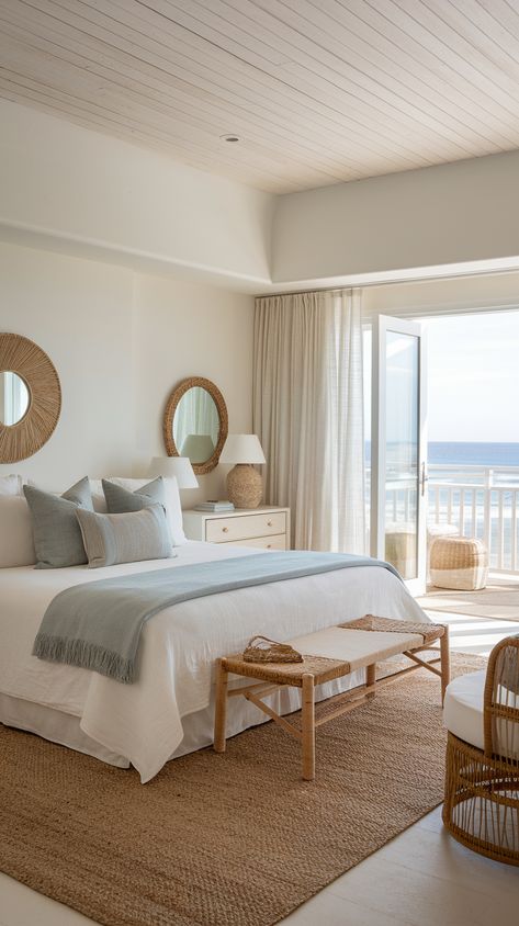 modern coastal bedroom with coastal view on the window. blue bedding and rattan furniture. Coastal Home Bedroom, Beach Rooms Ideas, West Coast Bedroom, Coastal Apartment Bedroom, Beach House Aesthetic Interior Design, Coastal Granddaughter Bedroom Decor, Aesthetic Room Beach, Bedroom Inspirations Coastal, Aesthetic Beach Bedroom