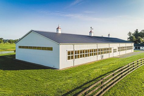 Quarry View Building Group completed this light-filled indoor arena in Marshall, Virginia. The white exterior is stunning. #QuarryViewBuildingGroup Indoor Riding Arena, View Building, Stable Style, Riding Arena, Indoor Arena, Riding Arenas, Equestrian Facilities, White Exterior, Horse Barn