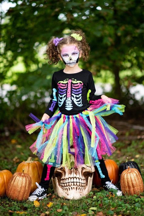 *Please refer to size chart for the best fit* Black crewneck top with rainbow skeleton design Ultra soft material for comfort & ease Pull-on style for easy dressing Black leggings also feature rainbow skeleton design Rainbow tulle skirt come with the set Add sweet fluttery style to her look with this 3pc Skeleton Tutu Pant Costume Set. This girls' costume is styled with a simple crew neck long sleeve top, matching leggings, and rainbow tulle skirt making it a staple addition to her Halloween or Rainbow Skeleton Costume, Handmade Costumes For Kids, Rainbow Skeleton Makeup For Kids, Halloween Costume With Tutu, Skeleton Costume Diy, Rainbow Tulle Skirt, Rainbow Skeleton, Halloween Tutu Costumes, Toddler Costumes Girl