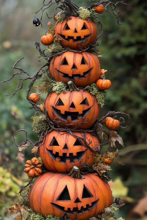 a stack of pumpkins with carved faces Pumpkin Topiary Ideas, Pumpkin Stacks, Stack Of Pumpkins, Fall Topiaries, Topiary Ideas, Pumpkin Topiary, Beautiful Pumpkins, Artificial Pumpkins, Faux Pumpkins