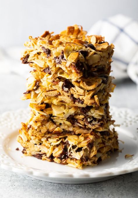 Low Carb Keto Cereal Bars Recipe VIDEO | This easy recipe makes crunchy, perfectly sweet cereal snack bars. Loaded with chocolate chips, coconut, and cinnamon cereal you won't believe these decadent treats are actually low carb and keto! - A Spicy Perspective Keto Cereal Bars Recipe, Keto Cereal Recipe, Low Calorie Cereal Bars, Homemade Keto Cereal, Chocolate Cereal Treats, Cereal Bars Recipe, Keto Cereal Store Bought, Snack Bar Recipes, Low Carb Cereal