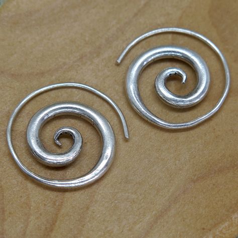 "Handmade Sterling Silver Spiral Earrings - Simple Rustic Thick Chunky swirl Tribal earrings ,\"fake Gauges\", For Women or Men Earrings Dimensions: Size: 1\" / 2.5cm - The thinner part is of the spiral is about 1mm (a normal earring's hook size), this part is about about 1.5\" / 4cm long. We also have similar versions of theses earrings: https://www.etsy.com/listing/480514617 https://www.etsy.com/listing/205519371 Weight: 0.265oz / 8gr Metal Purity: 95% Silver (Purer than 925 Sterling Silver) T Dope Jewelry, Spiral Earrings, Earrings Simple, Funky Jewelry, Jewelry Lookbook, Men Earrings, Party Jewelry, Jewelry Inspo, Simple Earrings