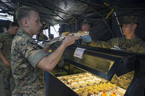 A Marine receives a build-your-own Okinawa taco rice meal entered in for judging during the W.P.T. Hill award competition at Camp Kinser, Okinawa, Japan. Photo by Carlos M. Vazquez II/Stars and Stripes #okinawa #tacorice #marine #usmc #japan #usmilitary #marines #militaryfood Military Camp Food, Marines Aesthetic, Army Food, Military Food, Hungary Food, Romania Food, Tanzania Food, Army Camp, Military Camp