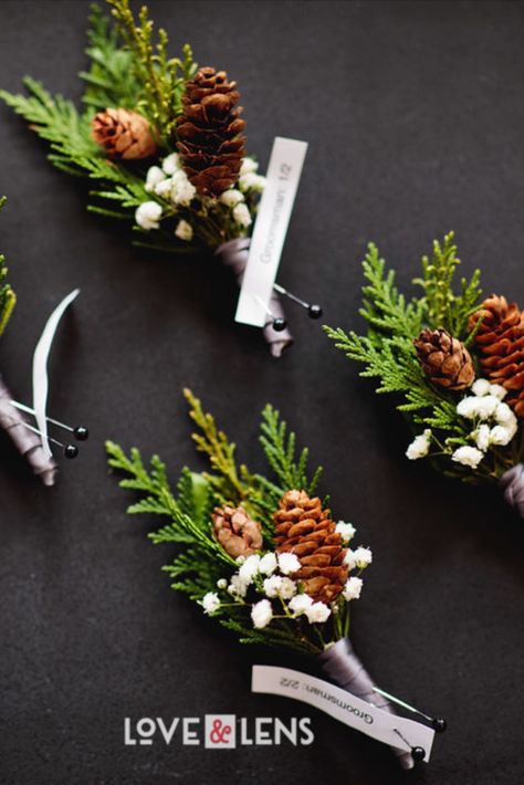 Playing with seasonl greenery and pinecones is so fun for a winter wedding. These boutonnieres incorporating pinecones, greenery and pops of white make for great, classic winter vibes. #winterwedding #pinewedding #pinecone #boutonniere #groom Pine Tree Wedding Bouquet, Boutonniere Winter Wedding, Winter Wedding Flowers Bouquets White Pine Cones, Wedding Centerpieces With Pinecones, Winter Wedding Boutonniere White, Evergreen Bouquet Wedding, Simple Winter Bouquet, Small Winter Wedding Bouquet, Pine Boutonniere