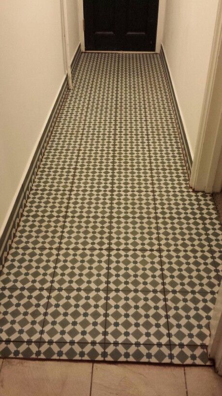 Topps Tile hallway with border as skirting board Tiled Skirting Boards, Tiled Skirting, Tile Hallway, Hallway Tiles Floor, Japandi Bathroom, Tiled Hallway, Topps Tiles, Flat Ideas, Skirting Boards