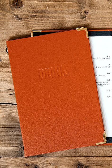 Hardback drinks menu cover design for Pint Shop, a pub & restaurant in Cambridge. Simple execution of debossing but wrapped in a bold orange for standout on the tables. By SAINT Design London #WeDoReallyNiceStuff | #menudesign #restaurantmenu #design #deboss #pubmenu Menu Cover Design Restaurant, Pub Menu Design, Shop Menu Design, Pub Branding, Orange Restaurant, Menu Cover Design, Restaurant Menu Covers, Pub Restaurant, Menu Cover