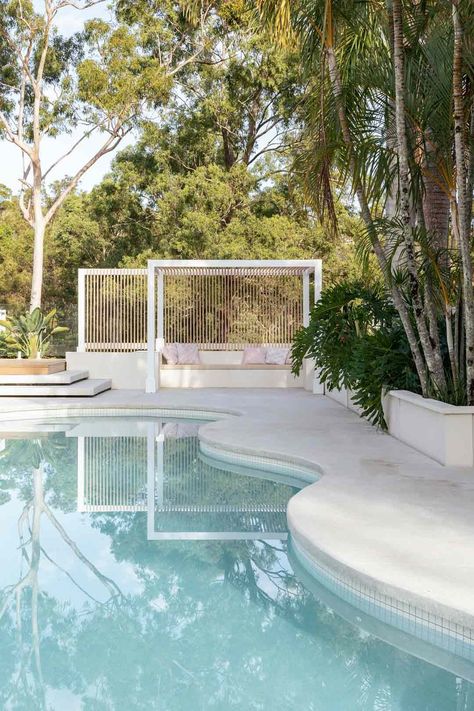 5 Pool Area Ideas to Consider When Redesigning Your Outdoor Haven | ABI Interiors Modern Coastal Pool Area, Coastal Backyard Pool, Coastal Pool Landscaping, Modern Coastal Landscaping, Coastal Pool Area, Pool Area Ideas Australia, Modern Pool Fence, Curvy Pool, Outdoor Entertaining Area Pool