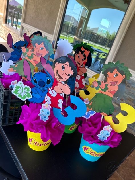 Diy Stitch Centerpieces, Lilo And Stitch Table Centerpiece, Stitch Diy Decorations, Diy Lilo And Stitch Centerpieces, Stitch Party Centerpiece Ideas, Lilo And Stitch Birthday Party Centerpieces, Stitch Party Centerpieces, Stitch Centerpiece Ideas Diy, Stitch Birthday Centerpieces