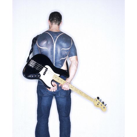 Tim Commerford Holding his bass. Photo by Ross Halfin Tim Commerford Tattoo, Brad Wilk, Tim Commerford, Ross Halfin, Tom Morello, Bohemian Style Men, Bass Players, Rage Against The Machine, Rock Guitar