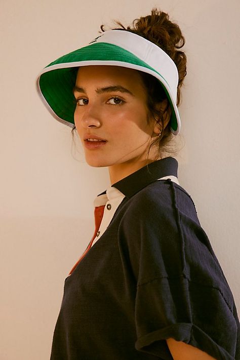 Ready for anything in a retro-inspired design, this so cool sun visor is featured in a sporty silhouette with color block detailing, defined brim, and classic logo for a special finishing touch. **Features:** Classic visor style, adjustable fit, defined brim **Why We ❤ It:** Designed to take you from the beach to the golf course to a simple stroll on a bright day, this staple sun visor is sure to be your go-to no matter the activity. | Kangol Golf Sun Visor at Free People in Green Visor Outfit, Golf Hats, Coney Island, Sun Visor, Classic Logo, Boho Clothing, Golf Course, Retro Inspired, Sun Hats