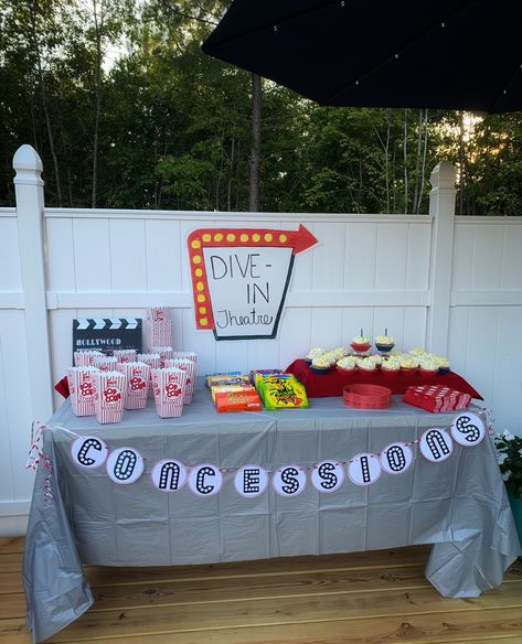 Drive In Concession Stand, Pool Movie Birthday Party, Lawn Movie Night Party Ideas, Dive In Movie Party, Outdoor Movie Pool Party, At Home Concession Stand Movie Nights, Yard Movie Night Ideas, Movie Pool Party Ideas, Movie Night In The Pool