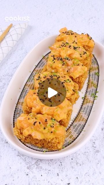 Cookist Wow on Instagram: "We all agree that #rice and #salmon pair amazingly well together? 😋❤️
So don’t miss the recipe to make these super crispy and spicy nuggets everyone will love 🥰

👉INGREDIENTS
450g (2 1/2 cups) of sushi rice
490g (2 cups) of water
400g of salmon fillet
3 egg yolks
15g (1 tbsp) of mustard
15g (1 tbsp) of rice vinegar
Salt
15g (1 tbsp) of sriracha
Oil for frying
Black sesame seeds
Lime (zest)
 
👉METHOD
1. Wash and add the sushi rice into the pot. Pour the water over the rice and let it boil for 15 minutes.
2. Place a sheet of cling film on the baking tray and place the cooked rice pressing it well. Cover with cling film and transfer to the fridge for 1 hour.
3. Cut the salmon into small pieces and set aside.
4. In a bowl add the egg yolks, mustard, rice vinegar, Spicy Nuggets, Rice And Salmon, Cookist Wow, Well Cover, Salmon Fillet, Black Sesame Seeds, Cooked Rice, Cling Film, Egg Yolks