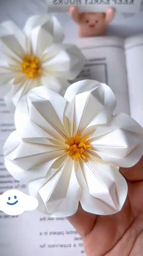 Unlock your creativity with our origami tutorials! Whether you're a beginner or an advanced crafter, our step-by-step guides will help you master the art of paper folding. Create stunning designs and add a unique touch to your DIY projects with our origami videos. #OrigamiDIY #PaperCrafts #ArtProjects Paper Flower Folding, How Do You Make Paper Flowers Diy Crafts, Paper Origami Flowers Easy, Origami Flower Stem, Simple Cute Origami, Origami Crafts Step By Step, Unique Paper Crafts, Origami Paper Flowers Tutorial, Cute And Easy Paper Crafts