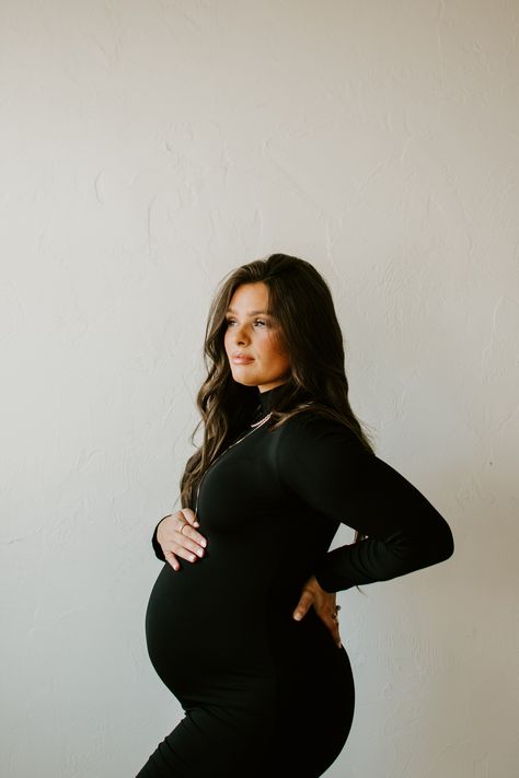 Winter Maternity Pictures Dress, Black Dress Maternity Dress, Maternity Pics Black Dress, Mommy Me Maternity, Indoor Diy Maternity Photoshoot, Maternity Photo Dress Fall, Tight Pregnancy Dress, Black Sweater Dress Maternity Photos, Indoor Maternity Photoshoot Outfits