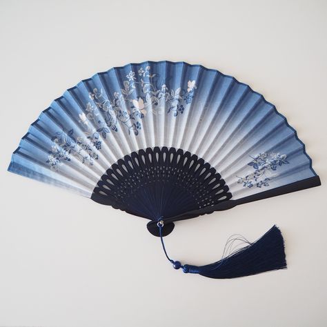 Summer Sale!  30% Off on all hand fans. Use this code at the checkout. SUMMER30 This Folding Fan is a perfect item for any season. It not only keeps you cool, but also adds a touch of fashion to your look. Get one for yourself and one for your loved one. Length (closed): 21cm Material: cotton, bamboo Comes with a free fan case (colour and pattern selected at random.)  As this is a handmade item please be aware there may be some imperfections such as glue spots and colour differences through the Fan Aesthetic Japanese, Traditional Japanese Fan, Fabric Hand Fan, Blue And White Floral Pattern, Weaponized Hand Fan, Japanese Hand Fan, Chinese Folding Fan, Red Spider Lily, Chinese Fan