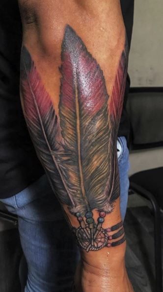 Warrior Feather Tattoo, Navajo Feather Tattoo, Indian Feather Tattoos Men, Western Style Tattoos Men, Indian Tattoo Design For Men, Native Feather Tattoos, Country Tattoos For Men, Navajo Tattoo, Native American Warrior Tattoos