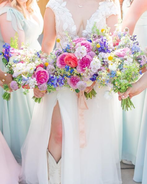 There may have been 60-70 stems in this babe of a bouquet. Some of my most diverse work! The thing I love most about this bridal bouquet was the variety of colors and textures. Deep pink Queen Mayra garden roses, lavender scabiosa, dainty chamomile, light blue and deep purple delphiniums, pennycress, locally grown nigella from my flower friend @redhandlefarm, pops of craspedia, so much pink and lavender gillyflower, white and coral elegance ranunculus. I ser... Ranunculus Bridesmaid Bouquet, Lavender Scabiosa, Roses Lavender, Colorful Wedding Bouquet, Purple Wedding Bouquets, Blue Wedding Bouquet, Pink And Lavender, Spring Wedding Flowers, Colorful Wedding