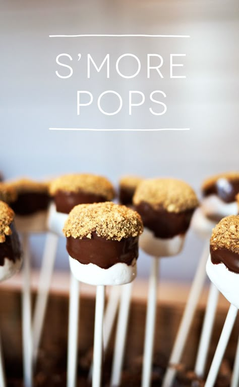 Marshmallow S'more Pops! Going to a holiday party, or hosting one of your own? You need these sweet treats in your life! It's an easy dessert with only 3 ingredients S’more Marshmallow Pops, Hedgehog Donut Holes Recipe, Smore Marshmallow Pops, Big Marshmallows Ideas, S’more Pops, Marshmallow Ideas For Party, Smores Marshmallow Pops, Diy Party Desserts Treats, Easy Birthday Party Treats