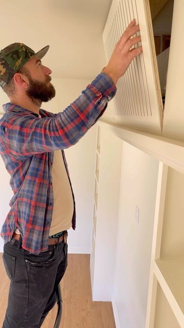 Cicada Co. on Instagram: "This beautiful sunroom addition required the use of a mini-split HVAC unit, however, we did not want the cassette to be the focal point of the room. We designed this bookcase and soffit to center up the room and disguise the unit itself. Our team fabricated this custom grill with magnetic closures to access the unit for maintenance or repair! #interiordesign #designbuild #minisplit #custombuild #customcabinetry #custommillwork #customeverything" Hide Mini Split, Hide A Mini Split, Mini Split Cover Ideas, Mini Split Cover, Wall Remodel, Sunroom Addition, Custom Grill, Hvac Unit, Split System