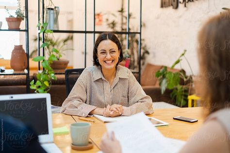 Happy coworkers during a collaborative meeting while discussing new business plan in a modern workspace. Happy Coworkers, New Business Plan, Team Working Together, Team Collaboration, Business Stock Images, Modern Workspace, Business Team, Team Photos, New Business