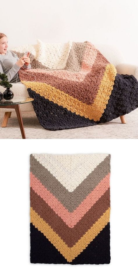 Colorful C2C Blankets for Your Home. This huge chevron blanket in the pictures below is the work by Yarnspirations Design Studio and it's a bold and gorgeous piece, that is sure to become the focal point in any room in your home! It's super versatile and easy to customize in any color! #freecrochetpattern #blanket #throw Crochet Blanket For Living Room, Crocheted Blanket Color Schemes, Corner To Corner Blanket Crochet Pattern Free, Colorblock Crochet Blanket, Colorful Crochet Baby Blanket, Blanket Color Schemes Crochet, Fall Crochet Blanket Color Combos, 5 Color Crochet Blanket Pattern, Warm Crochet Blanket Pattern