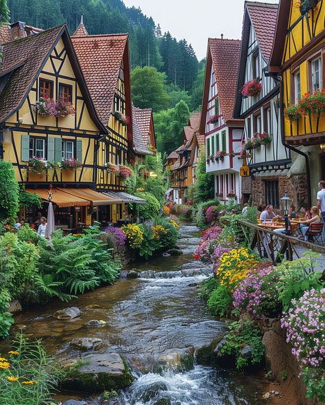 Half-timbered houses & vibrant flowers in a German town. Explore historic landmarks in Germany. #GermanyLandmarks #HistoricGermany #TravelGermany #VisitGermany Germany Places To Visit, Living In Germany Aesthetic, Travel Germany Beautiful Places, German Architecture Aesthetic, Germany Buildings, Old German Houses, Germany Houses, Germany Village, European Flowers