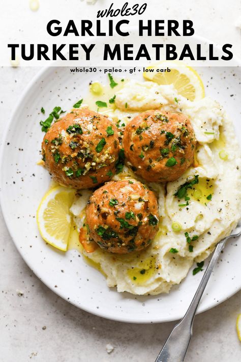 These baked whole30 garlic herb turkey meatballs are a tasty protein rich main dish that are made with ground turkey, fresh herbs, garlic, lemon, and ghee. Perfectly balanced, cooked to perfection, and made without cheese or breadcrumbs. Whole30, paleo, gluten free, low carb + keto friendly. #whole30recipes #turkeymeatballs #glutenfreedairyfree #lowcarb #ketofriendly Whole 30 Turkey, Garlic Herb Turkey, Whole30 Turkey Meatballs, Paleo Turkey Meatballs, Gluten Free Turkey Meatballs, Turkey Meatballs Recipe, Paleo Turkey, Ground Turkey Meatballs, Gluten Free Turkey