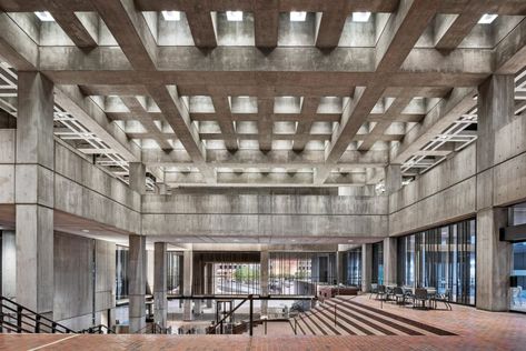 Preserved details inside meanwhile include the punctured grid concrete ceiling and large concrete pillars the scale the open-plan complex. Boston Architecture, Brutalist Interior, Boston City Hall, Boston City, Concrete Buildings, Brutalist Buildings, Concrete Facade, American Architecture, Level Design