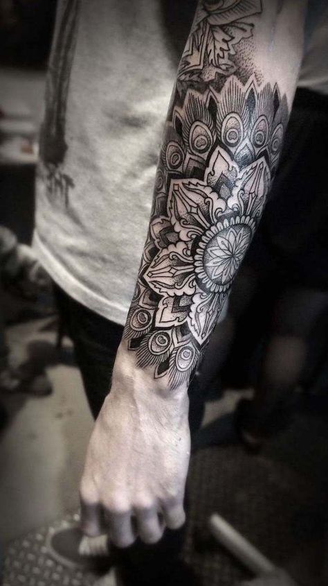 grey-shirt-jeans-mandala-wrist-tattoo-forearm-tattoo Mandala Tattoo Mann, Forearm Mandala Tattoo, Mandala Arm Tattoos, Mandala Tattoo Men, Mandala Thigh Tattoo, Mandala Wrist Tattoo, Mandala Tattoo Sleeve, Catrina Tattoo, Geometric Sleeve Tattoo