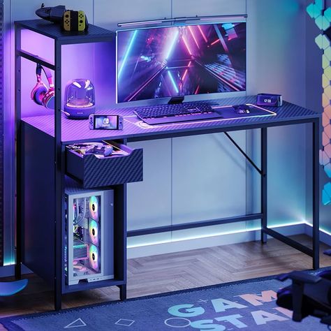 Amazon.com: Bestier Gaming Desk with Drawer and LED Lights, 48 inch Computer Desk PC Table with Adjustable Storage Shelves and Hook for Home Office and Small Spaces, Carbon Fiber Black : Home & Kitchen Cheap Gaming Setup, Video Game Rooms Boys, Gaming Desk With Shelves, Computer Shelf, Gaming Desk With Drawers, Gaming Desk With Storage, Desk With Shelves, Startup Office, Gaming Desk Setup