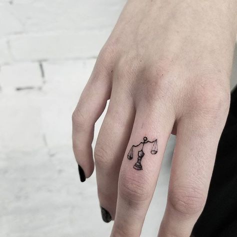 Tiny libra scale tattoo done by @release852 @inkandwatertattoo..If you are looking for one of a kind art, don't be shy, DM us to schedule an appointment or consulatation   Tag your friends help me grow ☘ #release852 #torontotattoo #torontotattooartist #ta Libra Scale Tattoo, Tattoo Main, Libra Constellation Tattoo, Justice Tattoo, Libra Tattoo, Petit Tattoo, Scale Tattoo, Tattoos Geometric, Zodiac Tattoos