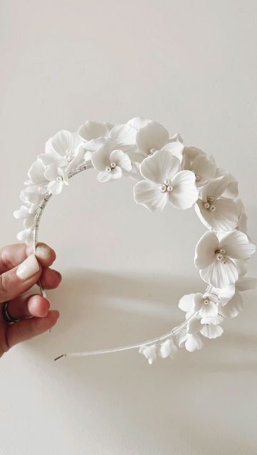 V I V I E M B E L L I S H on Instagram: "Gorgeous bespoke ＶＥＲＯＮＡ in white with less height and Swarovski petal centres. Heading off to Mykonos for our beautiful bride-to-be's wedding day 🤍 . . . #viviembellishbridal #bridalheadband #bridalhairaccessories #bridalideas #weddingheadband #bride #bridal #bridalstyle #bridallook #weddinghairaccessories #bridetobe #instabride #bridalinspo #floralheadband" Floral Hairband, Bridal Hair Bands, Flower Shop Interiors, Flower Headpiece Wedding, Bridal Floral Headpiece, Flower Girl Accessories, Flower Tiara, Bride Floral, Bride Headpiece