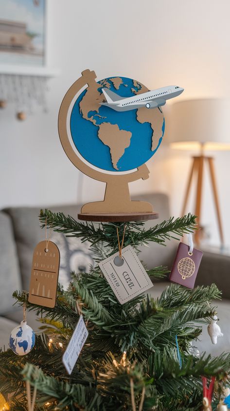 travel themed christmas tree with globe topper Diy Travel Ornaments, Travel Christmas Tree, Travel Party Decorations, Diy Map, Aviation Theme, Map Ornaments, Travel Ornament, Travel Christmas, Travel Tree