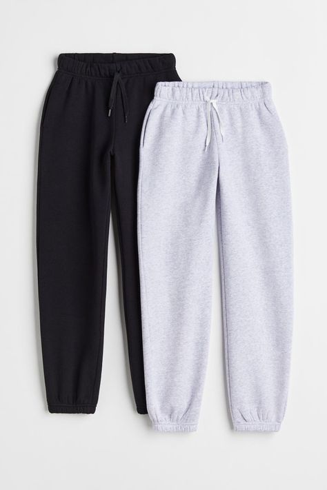 Track pants in sweat fabric. Featuring covered elastication and a drawstring at the waist and discreet side pockets. Tapered legs with covered elastication at the hems. Soft brushed inside. Girl Sweatpants, M Beauty, Grey Sweatpants, Black Accents, Drawstring Waistband, Black Light, Fashion Company, Tapered Legs, Capsule Wardrobe