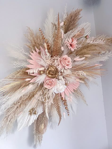 Stunning blush, gold and neutral pampas dried flower wall decor! Suitable for your salon, in your home or for your wedding! It consists of fluffy pampas, dried, preserved and artificial flowers and is totally customisable so if you would like to tweak the size or colour please message me and I will be happy to help 😊  It is really easy to install. 2x strong adhesive hooks will be supplied with it which you stick to the wall and hook onto the back of the piece. Size mini = 50cm wide Size medium = 70cm wide  Size large = 90cm wide  The piece in the photo is medium. Please message me if you are requiring it urgently and I will see what I can do. Everything I make is handmade and therefore no two pieces are the same. The colours will match what you have ordered but different flowers maybe use Party Decorations With Flowers, Pink And Gold Salon Decor, Pink And Gold Salon, Boho Flower Arrangements, Faux Flower Decor, Pampas Wall Decor, Gold Flowers Wedding, Pink Flower Decor, Pampas Wall