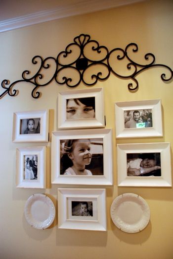 Black and white photos in white frames...I would have chosen black, but I like the white better with the yellow wall. Displaying Pictures, Wrought Iron Wall Decor, Picture Arrangements, Deco Champetre, Photo Arrangement, Metal Tree Wall Art, Iron Wall Decor, Gallery Walls, Yellow Walls