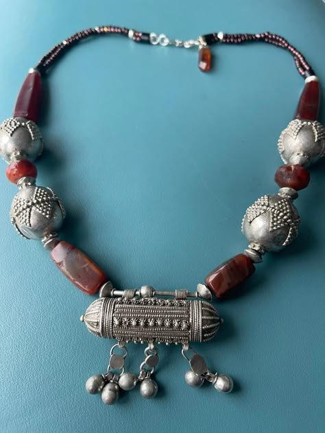 Yemen ethnic beads and old Hirz prayer box, good silver with makers' mark combined with Carnelian and Idar Oberstein Carnelian. the Yemen ethnic beads in good silver are with modern decoration, quite unusual. the Hirz (prayer box is from around 1950 and carry the good silver and maker's seal. as shown on one of the photos This necklace is charming and practical because of its length and will give style to a plain dress or top. The mark on the Prayer box is the Bawsani Yemen Jewelry, Middle East Jewelry, Short Necklaces, Handmade Ceramic Jewelry, Handmade Statement Necklace, Exotic Jewelry, Gold Jewellry, Asian Jewelry, Prayer Box