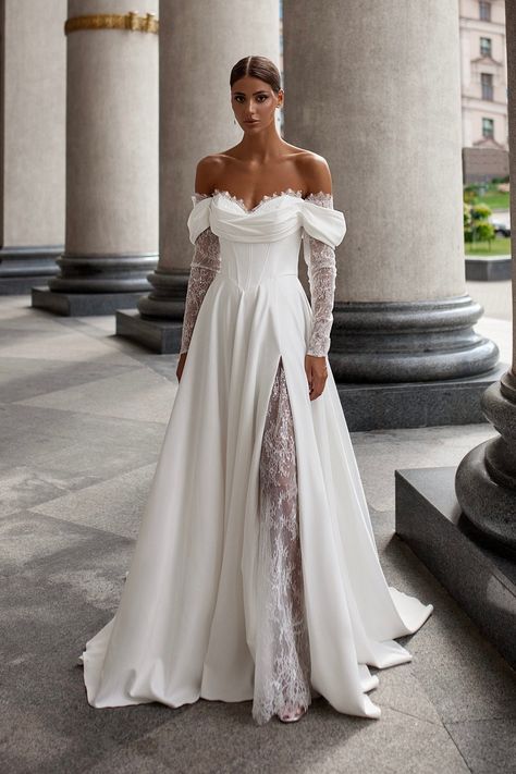 ❤️ ABOUT Step into timeless elegance with our lace-up A-line wedding dress. This exquisite gown features delicate lace sleeves that drape gracefully off the shoulders, creating a captivating cold-shoulder effect. The dress boasts a flattering corset bodice and a dramatic split skirt, which naturally forms soft folds over the delicate lace undergown, revealing a hint of leg. A flowing train adds a touch of sophistication, making this dress perfect for a bride seeking both romance and modernity on Corset Bridal Dress, Basque Waist Wedding Dress With Sleeves, Wedding Dress With Detachable Sleeves, Radiate Confidence, Exquisite Gowns, Dress With Pleats, Cold Shoulder Lace, Long Sleeve Wedding Dress Lace, Wedding Dresses Corset