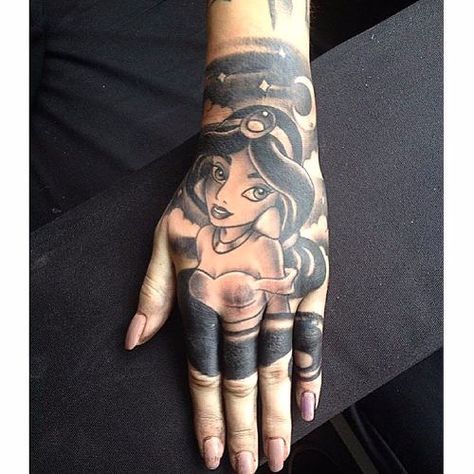 Princess Themed Disney Tattoos Princess Jasmine Tattoo, Aladdin Tattoo, Tattoos Disney, Jasmine Tattoo, Lamp Tattoo, Disney Princess Tattoo, Princess Tattoo, Hand And Finger Tattoos, Skeleton Hand Tattoo