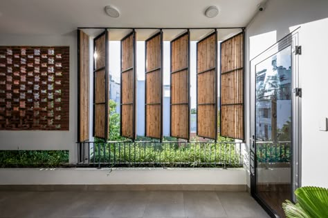 Gallery of Wind's House / Green Concept + Nha Cua Gio - 17 Sustainable Window Design, Green House Design Architecture, Wind Protection Architecture, Pivoted Windows, Housing Design Concept, House Balcony Design Ideas, Green House Interior Ideas, Inside Balcony, Pivot Window