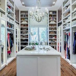 Gorgeous walk-in closet with hardwood floors, crystal droplets chandelier, marble top island for accessories, open shelving for shoes and clothes | EJ Interiors Master Closet Design, Master Closet Organization, Closet Island, Walking Closet, Dream Closet Design, Walk In Closet Design, Ideas Clothes, Closet Layout, Small Closets