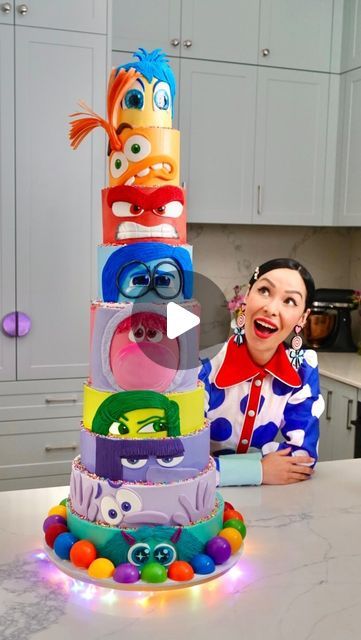 Katherine Sabbath on Instagram: "This is my most epic cake project yet! I’m embracing & celebrating all the emotions ahead of the release of @disneyaunz & Pixar’s #InsideOut2! This gigantic cake is made with layers of raspberry swirl sponge, filled with thick caramel & malted milk Swiss meringue buttercream. I used a mix of meringue buttercream & fondant to create each Emotion. The ‘memory orbs’ along the bottom of the cake are created with white chocolate spheres 🟣✨  My creative concept was to feature all nine Emotions in one epic, grand-scale, colourful cake with one tier for each Emotion. From top to bottom you can see: Joy, Anxiety, Anger, Sadness, Embarrassment, Disgust, Ennui, Fear & Envy. I’m super pleased this cake was shared around the studio with special guest Amy Poehler on @th Inside Out 2 Cake Ideas, Inside Out 2 Birthday Cake, Colourful Cakes Birthday, Inside Out 2 Cake, Inside Out Birthday Cake, Inside Out Cake Ideas, Inside Out Birthday Party, Inside Out Cake, Katherine Sabbath