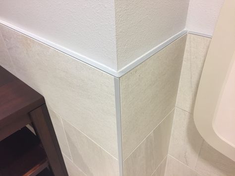 Schluter cap and corner tile on ceramic tile wainscot. At Bonita Valley Community Church. Corner Shower Ledge, Subway Tile Corner Edge, Tile Corner Trim, Corner Shelf In Shower Tile, Schluter Tile Edge, Bathroom Baseboard, Baseboards, Wainscoting, Tile Bathroom