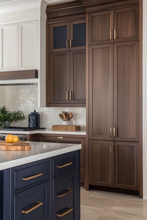 There’s just something about the classic combination of brown cabinets and white countertops that feels warm, welcoming and timeless in a kitchen. Rich brown cabinetry grounds the space while bright… White Counters With Dark Cabinets, Kitchen Inspo Dark Brown Cabinets, Deep Brown Kitchen Cabinets, Walnut And Navy Kitchen, Rich Wood Kitchen Cabinets, Warm Brown Kitchen Cabinets, Brown And White Kitchen Ideas, Medium Stained Kitchen Cabinets, Painted Brown Cabinets