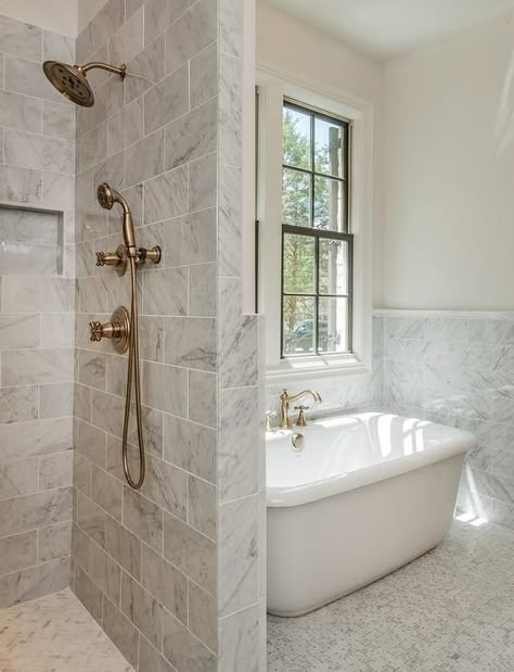 Gray bathroom features a freestanding tub atop a gray marble basketweave tiled floor placed under windows next to a walk-in shower clad in gray marble ... Shower Next To Tub, Grey Marble Bathroom, Bad Inspiration, Bathroom Remodel Shower, Trendy Bathroom, Bathroom Redo, Dream Bathrooms, Bathroom Layout, Grey Bathrooms