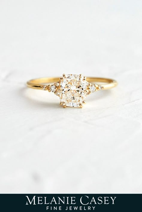 The Lady's Slipper Ring is a vintage-inspired setting with a delicate tapered 14k gold band with inset diamond accents. This version holds a rectangular cushion cut diamond focal - find the focal stone for your one of a kind Distance Ring from our Choose Your Stone collection at melaniecasey.com! Dainty Cushion Cut Engagement Ring, Rectangular Cushion Engagement Ring, Vintage Cushion Cut Engagement Ring, Weddin Rings, Cushion Engagement Ring Gold, Gold Engagement Ring Cushion, Cushion Cut Engagement Ring Gold, Engagement Rings Melanie Casey, Single Stone Engagement Rings